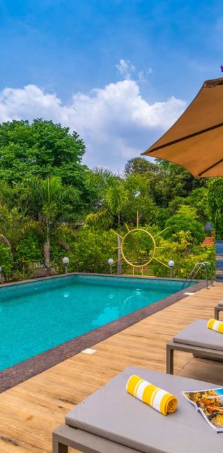 Nysa-Estate-5-bhk-luxury-villa-in-coorg-with-private-pool-and-spacious-rooms-poolside-sunbeds